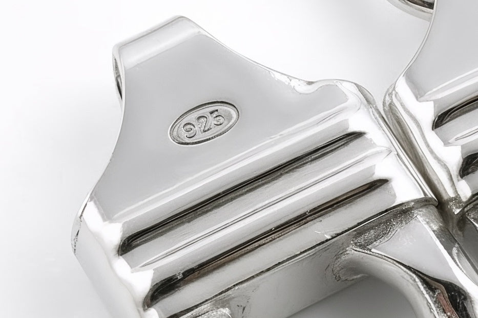 Macro of the 925 stamp on the end piece of a Neviera sterling silver Cuban link chain