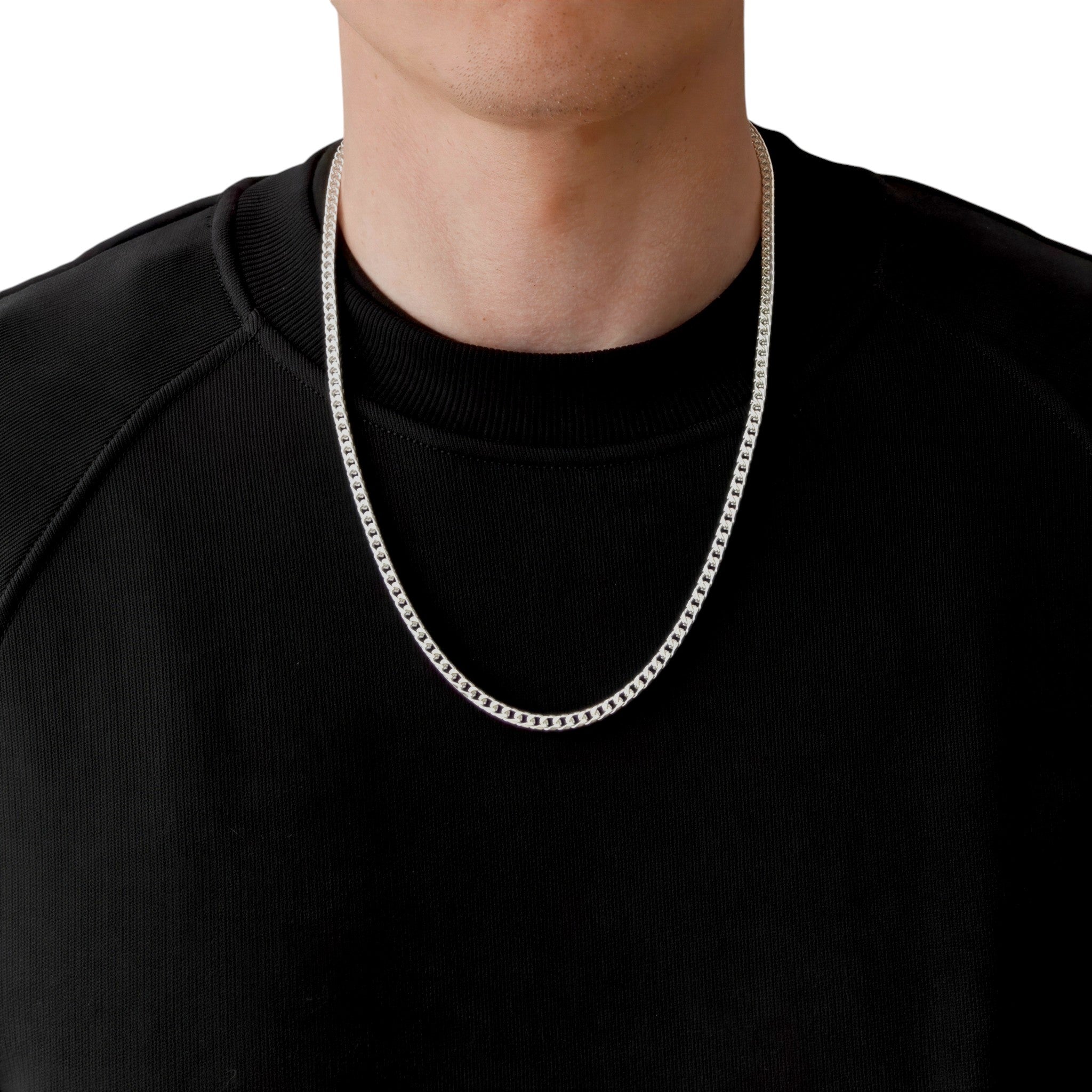 Neviera Franco chain necklace — Italian-made 925 sterling silver, 60cm length, 3,8mm width. Lifestyle photograph on model wearing the chain with a black crew-neck sweatshirt on a neutral background. Neviera specializes in high-quality Italian-made 925 silver chain necklaces and bracelets.