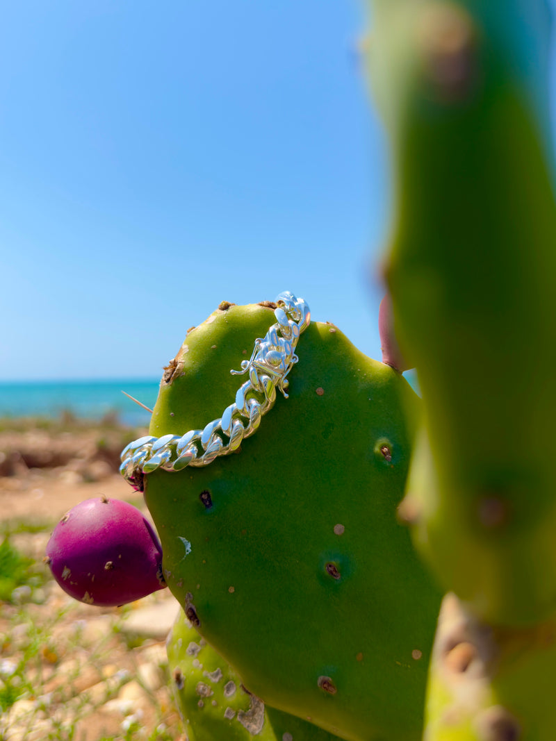 Neviera Cuban Link Chain Bracelet Hanging From a Cactus Tree