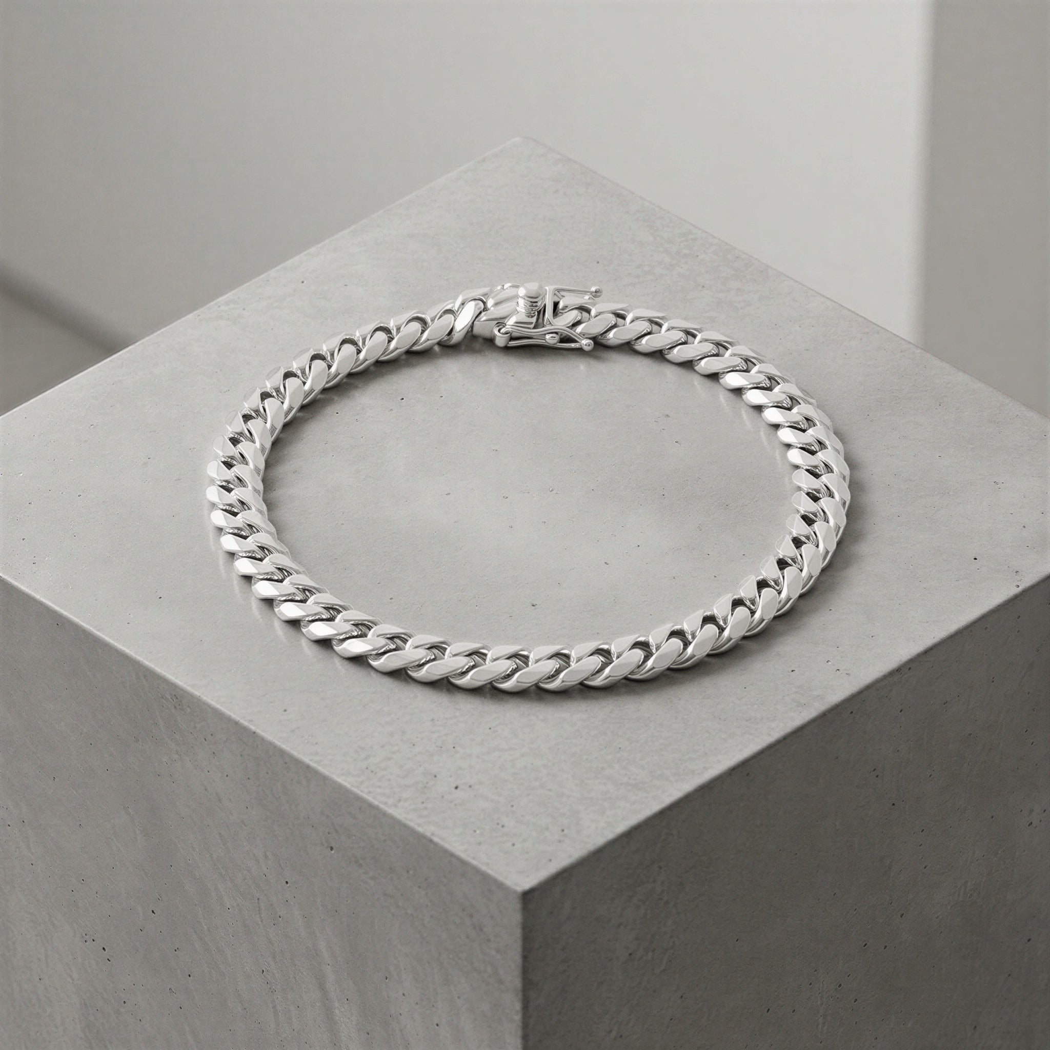 Neviera solid silver chain bracelet on concrete block