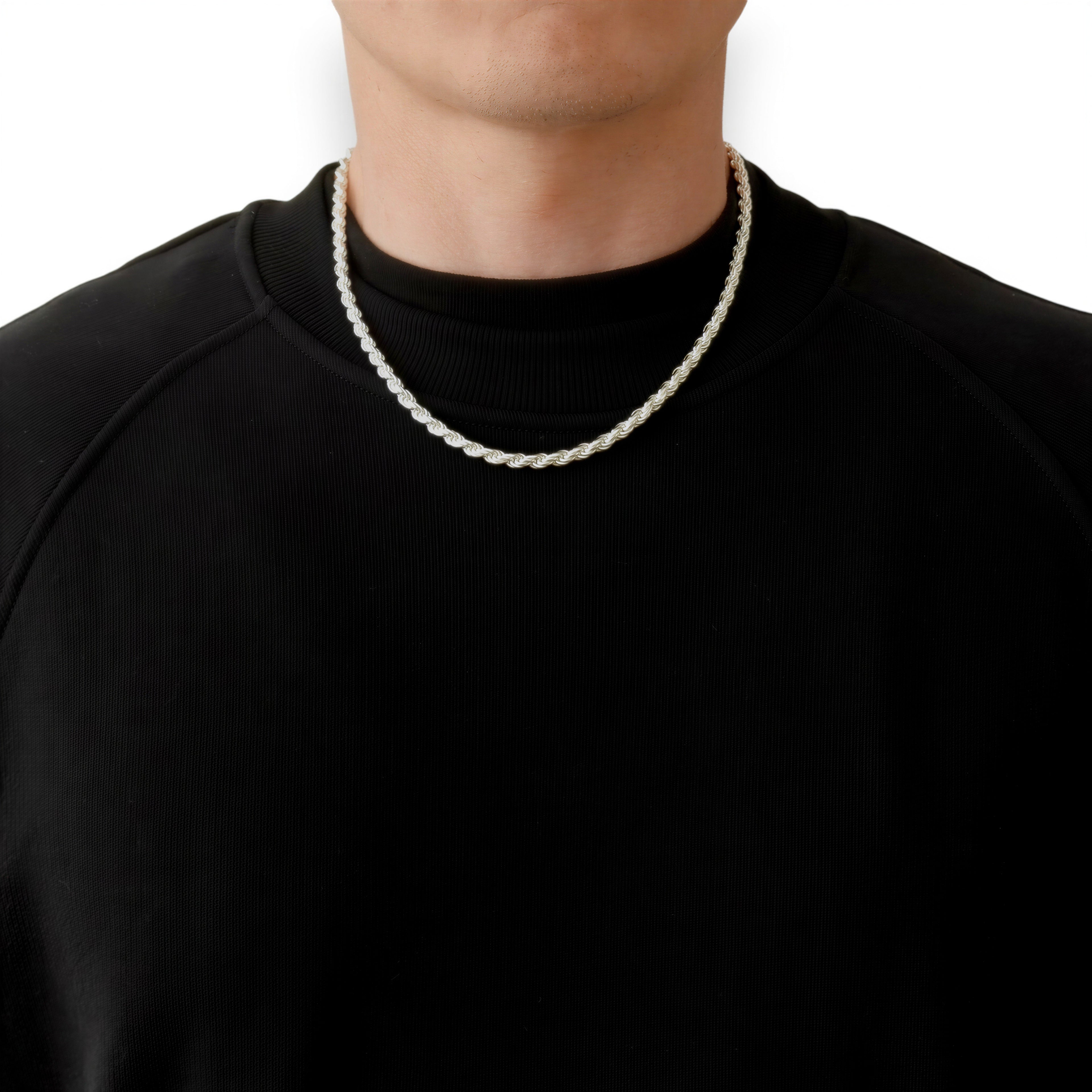Neviera rope chain necklace — Italian-made 925 sterling silver, 50cm length, 4,6mm width. Lifestyle photograph on model wearing the chain with a black crew-neck sweatshirt on a neutral background. Neviera specializes in high-quality Italian-made 925 silver chain necklaces and bracelets.