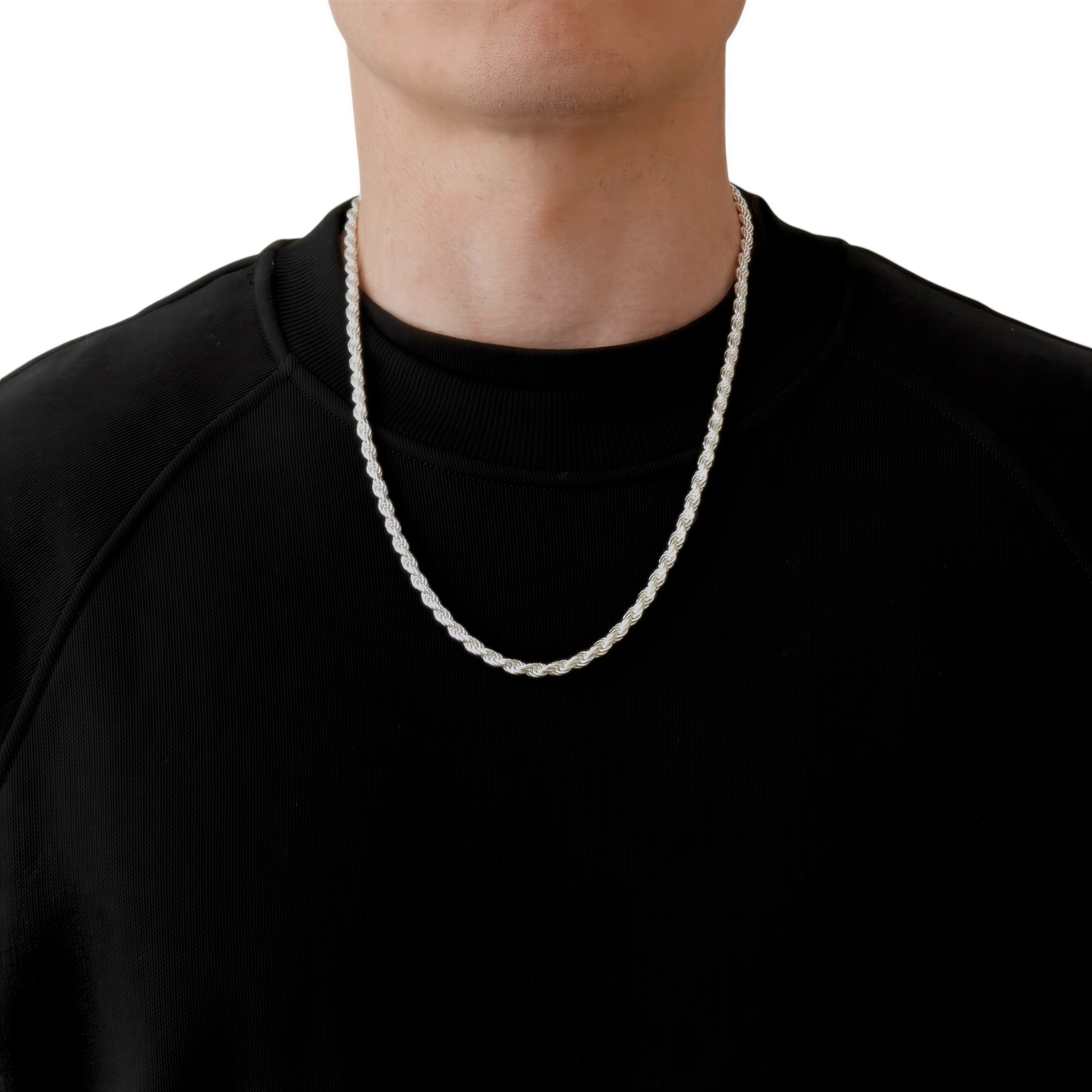 Neviera rope chain necklace — Italian-made 925 sterling silver, 60cm length, 4,6mm width. Lifestyle photograph on model wearing the chain with a black crew-neck sweatshirt on a neutral background. Neviera specializes in high-quality Italian-made 925 silver chain necklaces and bracelets.