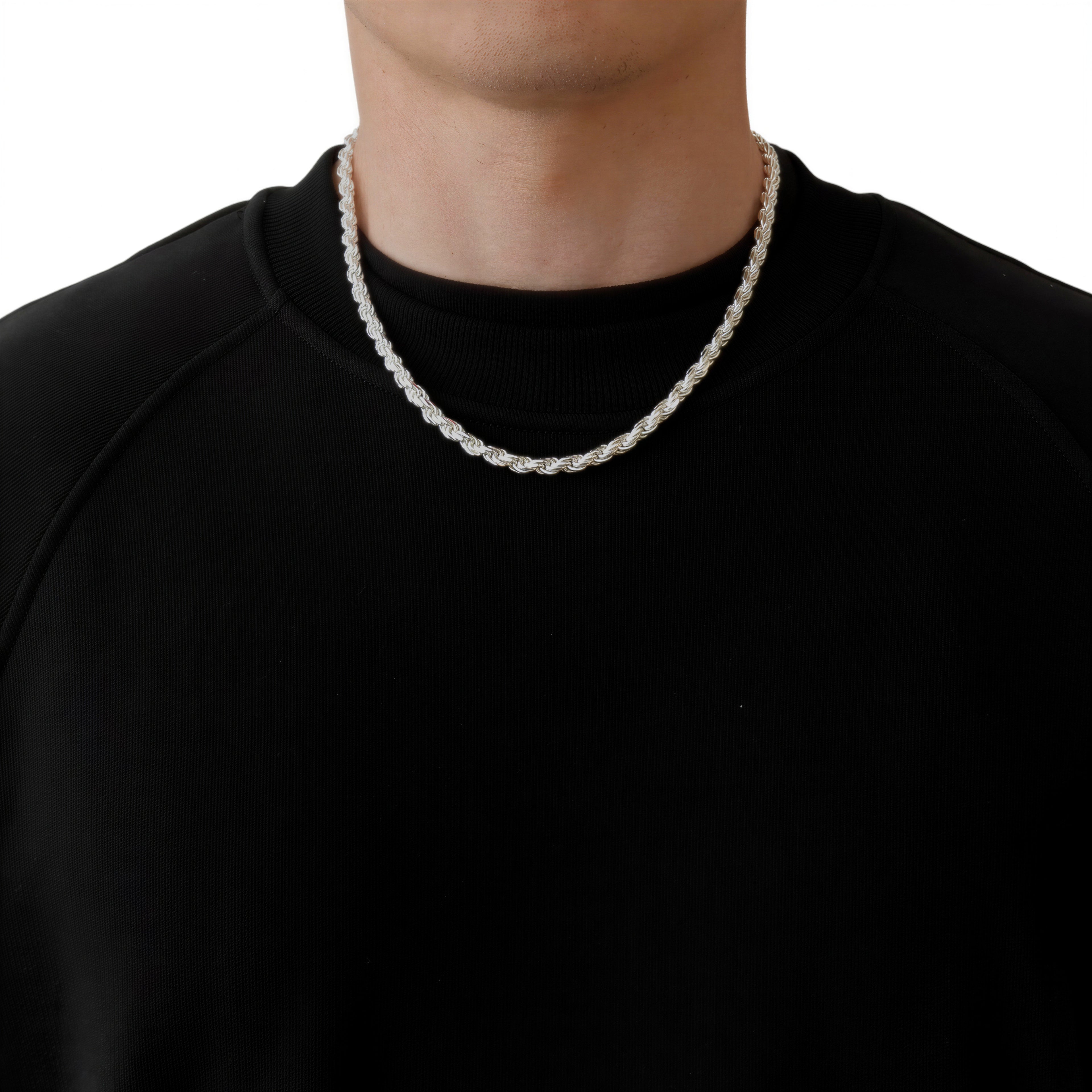 Neviera rope chain necklace — Italian-made 925 sterling silver, 50cm length, 5,7mm width. Lifestyle photograph on model wearing the chain with a black crew-neck sweatshirt on a neutral background. Neviera specializes in high-quality Italian-made 925 silver chain necklaces and bracelets.